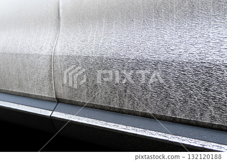 Side view of a very dirty car. Fragment of a dirty car. Dirty headlights, wheel and bumper of the car with swamp splashes on a side panel Side view of a very dirty car. Fragment of a dirty car. Dirty headlights, wheel and bumper of the car with swamp splashes on a side panel 132120188