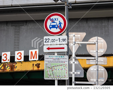 A sign indicating a no-taxis zone in Ginza and a map showing taxi stands A sign indicating a no-taxis zone in Ginza and a map showing taxi stands 132120305