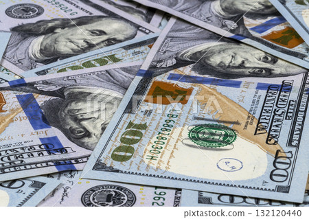Stack of one hundred dollar bills. Stack of cash money in hundred dollar banknotes. Heap of hundred dollar bills background. Concept of financial success. Stack of one hundred dollar bills. Stack of cash money in hundred dollar banknotes. Heap of hundred dollar bills background. Concept of financial success. 132120440