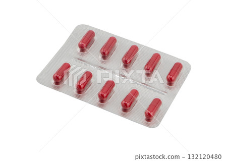 Macro shot pile of red tablets pill in silver blister packaging isolated on white background. Aluminium foil blister pack. Pharmacy products. Medicine pills and drugs. Pills background Macro shot pile of red tablets pill in silver blister packaging isolated on white background. Aluminium foil blister pack. Pharmacy products. Medicine pills and drugs. Pills background 132120480
