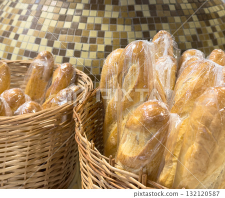Buns in wicker basket. Composition with bread and rolls 132120587