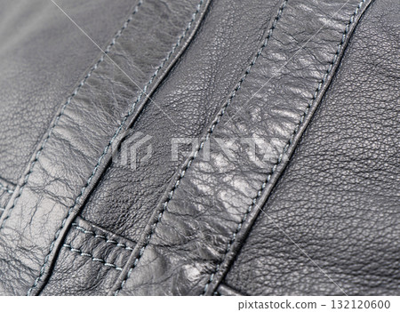 Macro shot leather texture background. Part of perforated leather details. Perforated leather texture background. Texture leather Macro shot leather texture background. Part of perforated leather details. Perforated leather texture background. Texture leather 132120600