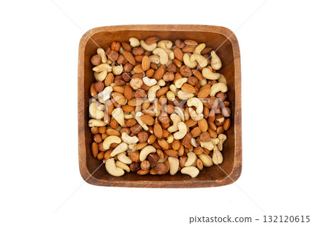 Different nuts in a heap isolated on white background. Peanuts, almonds, hazelnuts and cashews mixed. Nuts pattern Different nuts in a heap isolated on white background. Peanuts, almonds, hazelnuts and cashews mixed. Nuts pattern 132120615