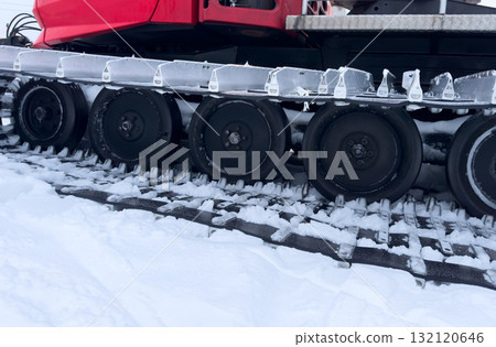 Snowcat machine for snow removal. Preparation ski trails. Snow groomer. Snowy tracks of snowcat in the mountains. Ratrac snowcat. Snow tucker 132120646
