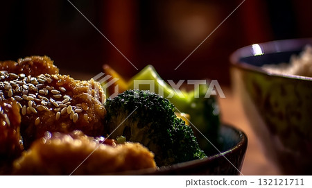 Delicious Asian Cuisine with Crispy Chicken and Fresh Broccoli. 132121711