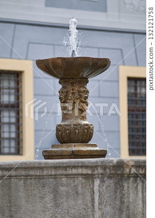 Ornate Stone Fountain in Historic Setting 132121758