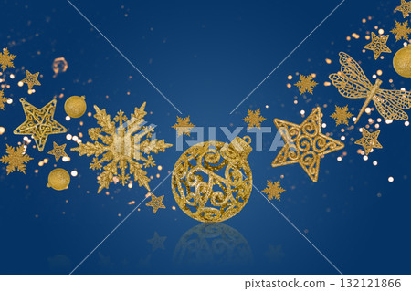 Christmas blue background with Christmas tree decorations with a golden snowflake, star and ball and golden lights with copy space. New Year and Christmas card. 132121866