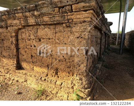 Close view of double headed eagle stupa with stone niches 132122284