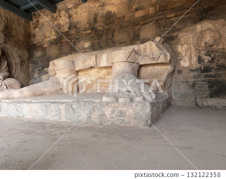 Close view of Buddha feet stone carving Dharmarajika site Taxila Pakistan ancient Buddhist heritage under sunlight 132122358