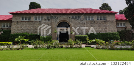 Heritage Taxila Museum Constructed in 1928 with Green Grass Lawn and Trees Highlighting Ancient History of Pakistan 132122494
