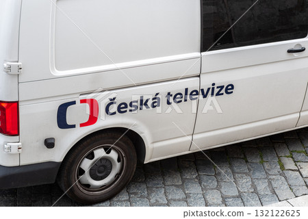 A white van with the logo of Czech National Television, parked on cobblestone street in Prague, Czech Republic A white van with the logo of Czech National Television, parked on cobblestone street in Prague, Czech Republic 132122625