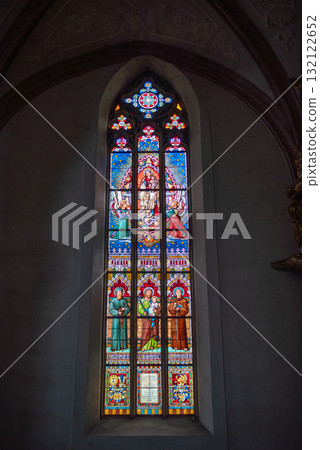 Stained glass window depicting religious figures in a church in Prague, Czech Republic Stained glass window depicting religious figures in a church in Prague, Czech Republic 132122652