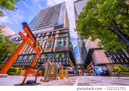 Tokyo cityscape in Japan. View of Fukutoku Shrine in the valley between buildings in Nihonbashi Muromachi. A redeveloped building is in the back right. Tokyo cityscape in Japan. View of Fukutoku Shrine in the valley between buildings in Nihonbashi Muromachi. A redeveloped building is in the back right. 132122731