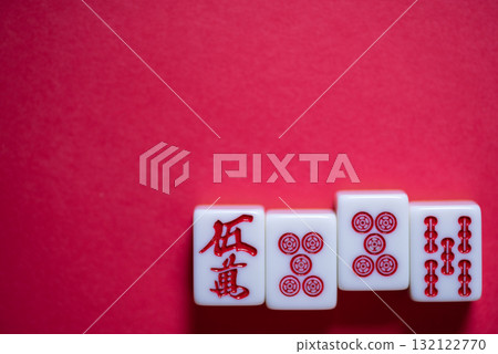 Mahjong tiles on a red background 132122770
