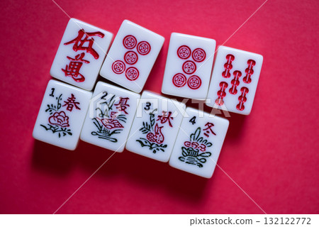 Mahjong tiles on a red background 132122772