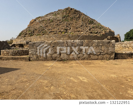 Dharmarajika stupa and monastery ruins in Taxila ancient Buddhist complex built during Ashokan period showing sacred heritage Dharmarajika stupa and monastery ruins in Taxila ancient Buddhist complex built during Ashokan period showing sacred heritage 132122951
