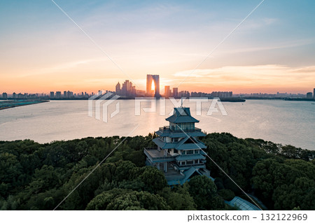 City skyline at sunset with historical architecture and vibrant colors over water City skyline at sunset with historical architecture and vibrant colors over water 132122969