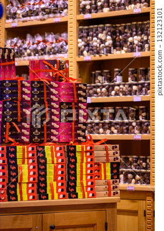 Belgian chocolate shop showcasing shelves filled with various chocolates in Brussels, Belgium 132123101