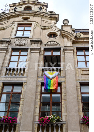 Progressive rainbow pride flag hanging from the balcony of an old building in historic city center of Brussels, Belgium 132123107