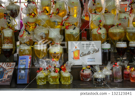 Display of beer-themed candles in glasses at a market stall in the historic centre of Bruges, Belgium Display of beer-themed candles in glasses at a market stall in the historic centre of Bruges, Belgium 132123841