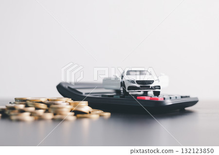 White car model with open door surrounded by stacked coins, symbolizing auto loan, car finance, investment, insurance, and savings concept on a clean minimal background. car finance 132123850