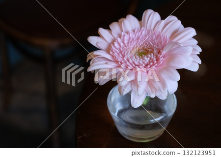 Gerbera flowers on a cafe table Gerbera flowers on a cafe table 132123951