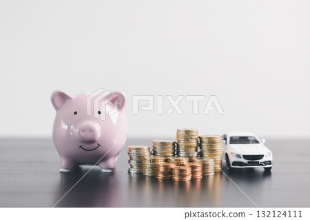 Pink piggy bank with stacked coins beside a white car model, representing savings, car loan, finance, investment, wealth management, insurance and money planning on clean minimal background. 132124111