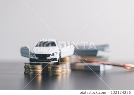 White car model with open door surrounded by stacked coins, symbolizing auto loan, car finance, investment, insurance, and savings concept on a clean minimal background. car finance White car model with open door surrounded by stacked coins, symbolizing auto loan, car finance, investment, insurance, and savings concept on a clean minimal background. car finance 132124236