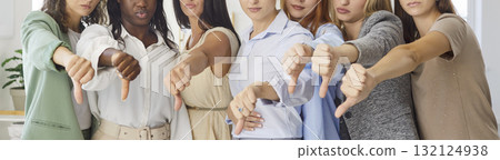 Close-up of diverse women showing thumbs down together, gesture of disapproval 132124938