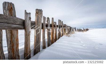 Rustic wooden fence buried in permafrost snow drift Life in permafrost conditions, climate change problems on the planet. Global warming 132125082