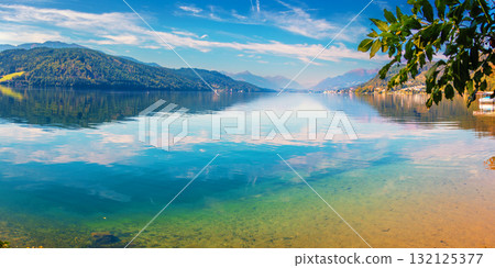 View of a mountain lake in autumn. Millstatt am See, Lake Millstatt in Carinthia, Austria, Europe View of a mountain lake in autumn. Millstatt am See, Lake Millstatt in Carinthia, Austria, Europe 132125377