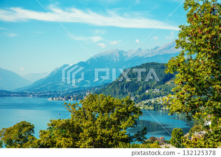 View of a mountain lake in autumn. Millstatt am See, Lake Millstatt in Carinthia, Austria, Europe View of a mountain lake in autumn. Millstatt am See, Lake Millstatt in Carinthia, Austria, Europe 132125378