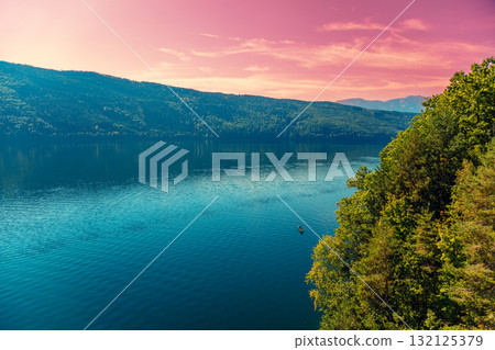 View of a mountain lake in autumn. Millstatt am See, Lake Millstatt in Carinthia, Austria, Europe View of a mountain lake in autumn. Millstatt am See, Lake Millstatt in Carinthia, Austria, Europe 132125379