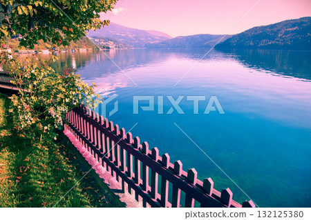 View of a mountain lake in autumn. Millstatt am See, Lake Millstatt in Carinthia, Austria, Europe 132125380