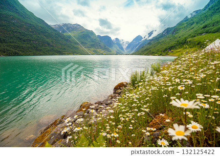 View of the glacier Oldevatnet Lake on a cloudy day. Beautiful wilderness of Norway View of the glacier Oldevatnet Lake on a cloudy day. Beautiful wilderness of Norway 132125422