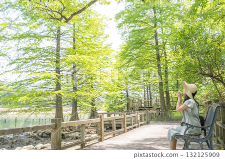 Woman resting in the forest Woman resting in the forest 132125909