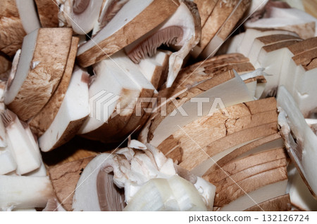 Close up of chopped chestnut mushrooms ready to be cooked fresh produce Close up of chopped chestnut mushrooms ready to be cooked fresh produce 132126724