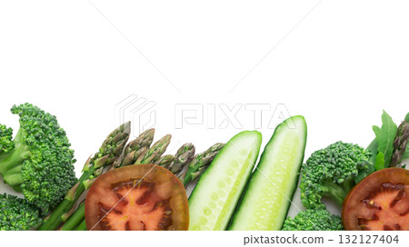 tasty frame of green vegetables broccoli, arugula, cucumber, asparagus, tomato and garlic on a white background tasty frame of green vegetables broccoli, arugula, cucumber, asparagus, tomato and garlic on a white background 132127404