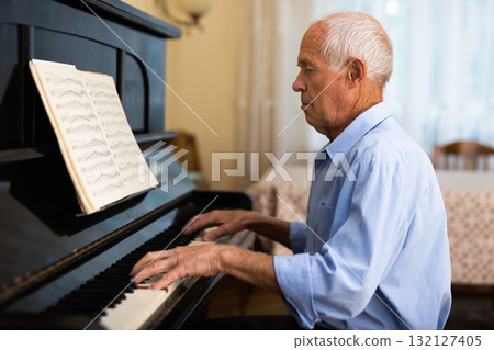 Compositor creating new music with piano at home 132127405