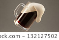 Frosted glass beer stein tilted with dark stout beer and thick creamy foam overflowing 132127502
