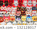Masks lined up at a festival stall 132128017