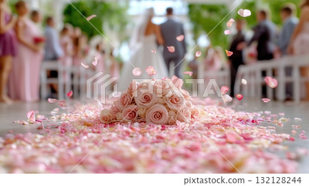 Wedding ceremony with rose petals scattered on the aisle in a garden setting 132128244