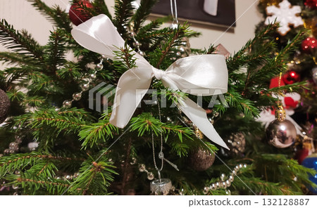 Christmas tree ornaments creating warm festive atmosphere. Christmas tree ornaments creating warm festive atmosphere. 132128887