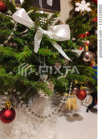 Christmas tree ornaments creating warm festive atmosphere. Christmas tree ornaments creating warm festive atmosphere. 132128888