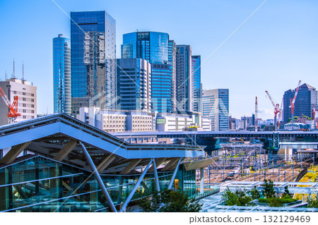 Tokyo cityscape in Japan. View of Shinagawa Station, office buildings, trains, etc. Takanawa Gateway Station is in the foreground. Tokyo cityscape in Japan. View of Shinagawa Station, office buildings, trains, etc. Takanawa Gateway Station is in the foreground. 132129469