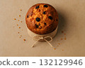 Top view of Italian panettone in a paper mold with twine bow 132129946