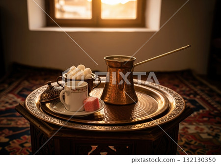 Traditional Bosnian coffee set with a copper cezve and Turkish delight on an ornate tray 132130350