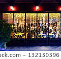Illuminated night cafe 132130396