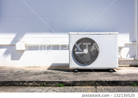 Outdoor air conditioner compressor unit on white wall with sunlight shadow Outdoor air conditioner compressor unit on white wall with sunlight shadow 132130520