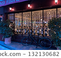 Christmas-themed night cafe and bicycle 132130682